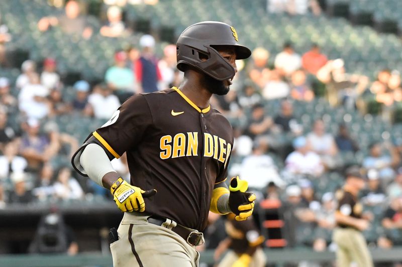 Oct 1, 2023; Chicago, Illinois, USA; San Diego Padres left fielder Jurickson Profar (10) runs to first base after hitting the game winning RBI single during the eleventh inning against the Chicago White Sox at Guaranteed Rate Field. Mandatory Credit: Patrick Gorski-USA TODAY Sports