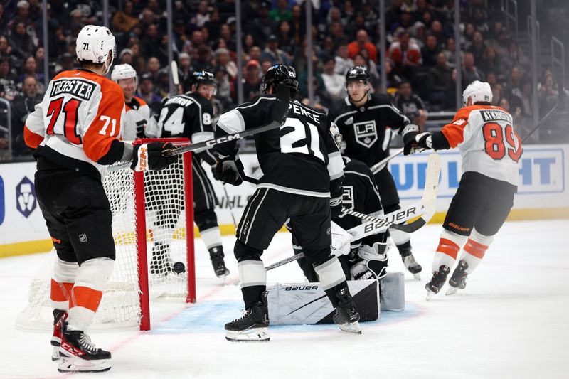 Nov 11, 2023; Los Angeles, California, USA;  Los Angeles Kings defenseman Jordan Spence (21) reacts after Philadelphia Flyers right wing Cam Atkinson (89) scores a goal during the third period at Crypto.com Arena. Mandatory Credit: Kiyoshi Mio-USA TODAY Sports