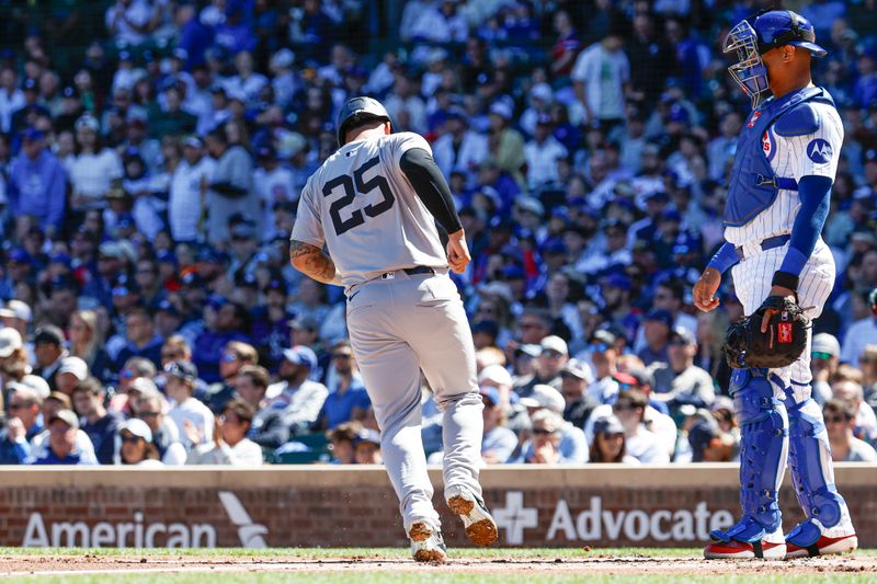 Sep 7, 2024; Chicago, Illinois, USA; New York Yankees second baseman Gleyber Torres (25) scores against the Chicago Cubs during the first inning at Wrigley Field. Mandatory Credit: Kamil Krzaczynski-Imagn Images
