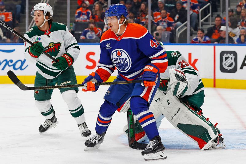 Nov 21, 2024; Edmonton, Alberta, CAN;  Edmonton Oilers forward Kasperi Kapanen (42) tries to screen Minnesota Wild goaltender Marc-Andre Fleury (29) during the first period at Rogers Place. Mandatory Credit: Perry Nelson-Imagn Images