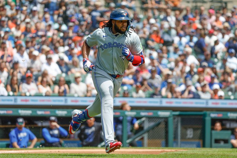 May 25, 2024; Detroit, Michigan, USA; Toronto Blue Jays first baseman Vladimir Guerrero Jr. (27) runs to first during an at bat in the first inning of the game against the the Detroit Tigers at Comerica Park. Mandatory Credit: Brian Bradshaw Sevald-USA TODAY Sports