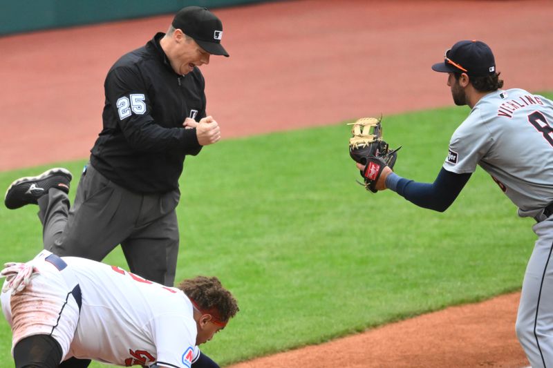 May 6, 2024; Cleveland, Ohio, USA; Third base umpire Junior Valentine (25) makes a call during a game between the Cleveland Guardians and the Detroit Tigers at Progressive Field. Mandatory Credit: David Richard-USA TODAY Sports