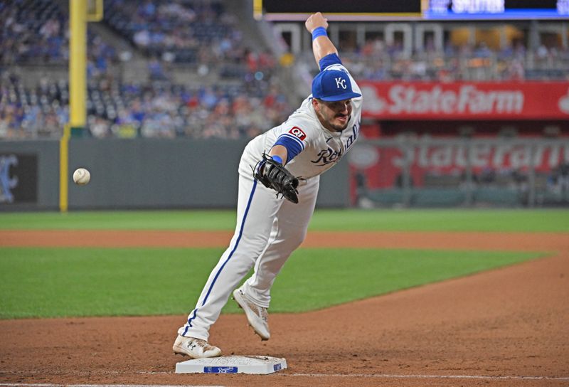 Jun 25, 2024; Kansas City, Missouri, USA;  Kansas City Royals first baseman Vinnie Pasquantino (9) stretches to catch a wild throw in the seventh inning against the Miami Marlins at Kauffman Stadium. Mandatory Credit: Peter Aiken-USA TODAY Sports