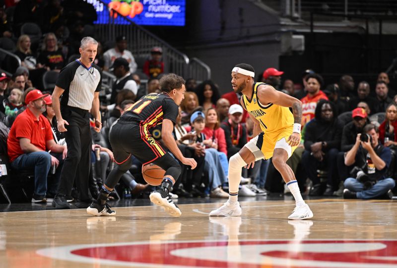 ATLANTA, GEORGIA - JANUARY 12: Trae Young #11 of the Atlanta Hawks drives to the basket during the game against the Indiana Pacers on January 12, 2024 at State Farm Arena in Atlanta, Georgia.  NOTE TO USER: User expressly acknowledges and agrees that, by downloading and or using this photograph, User is consenting to the terms and conditions of the Getty Images License Agreement. (Photo by Paras Griffin/Getty Images)