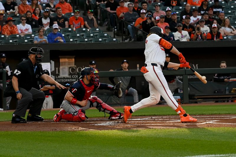 Apr 16, 2024; Baltimore, Maryland, USA; Baltimore Orioles shortstop Gunnar Henderson (2) hits a first inning single against the Minnesota Twins  at Oriole Park at Camden Yards. Mandatory Credit: Tommy Gilligan-USA TODAY Sports