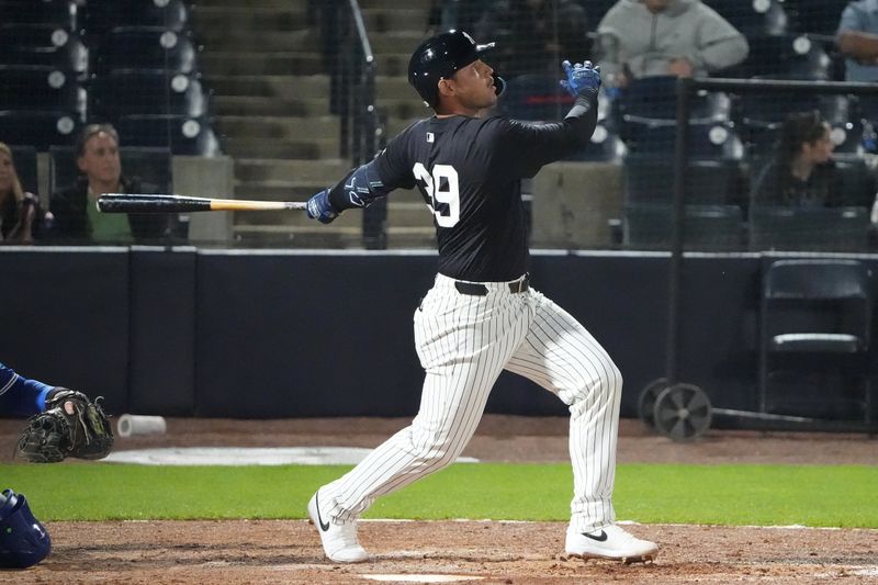 Feb 28, 2025; Tampa, Florida, USA; New York Yankees catcher Alex Jackson (39) hits a double against the Toronto Blue Jays during the sixth inning at George M. Steinbrenner Field. Mandatory Credit: Dave Nelson-Imagn Images