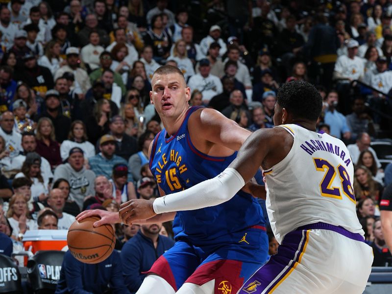 DENVER, CO - APRIL 20: Nikola Jokic #15 of the Denver Nuggets dribbles the ball during the game against the Los Angeles Lakers during Round 1 Game 1 of the 2024 NBA Playoffs on April 20, 2024 at the Ball Arena in Denver, Colorado. NOTE TO USER: User expressly acknowledges and agrees that, by downloading and/or using this Photograph, user is consenting to the terms and conditions of the Getty Images License Agreement. Mandatory Copyright Notice: Copyright 2024 NBAE (Photo by Garrett Ellwood/NBAE via Getty Images)