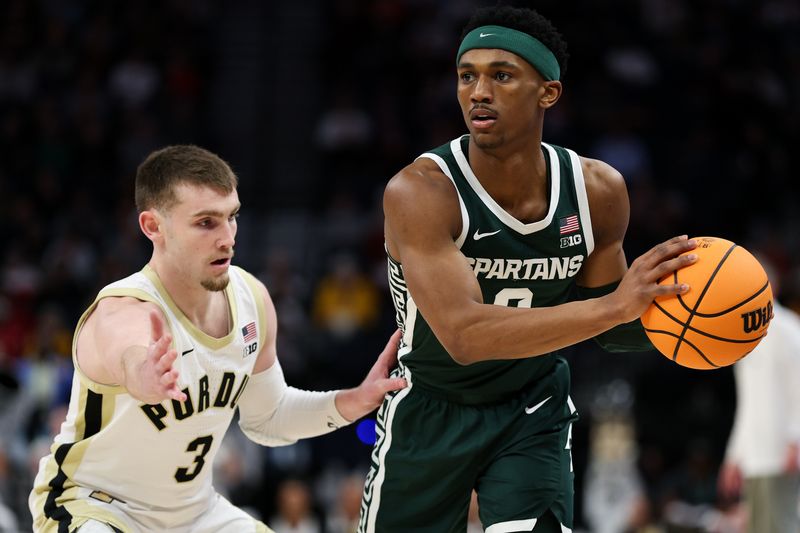 Mar 15, 2024; Minneapolis, MN, USA; Michigan State Spartans guard Tyson Walker (2) controls the ball as Purdue Boilermakers guard Braden Smith (3) defends during the second half at Target Center. Mandatory Credit: Matt Krohn-USA TODAY Sports