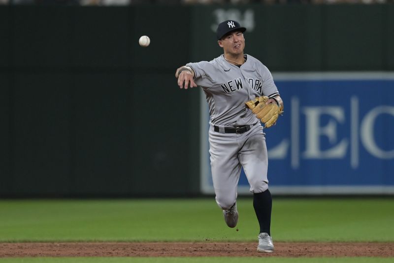 Jul 29, 2023; Baltimore, Maryland, USA;  New York Yankees shortstop Anthony Volpe (11) throws to first base during the sixth inning against the Baltimore Orioles at Oriole Park at Camden Yards. Mandatory Credit: Tommy Gilligan-USA TODAY Sports