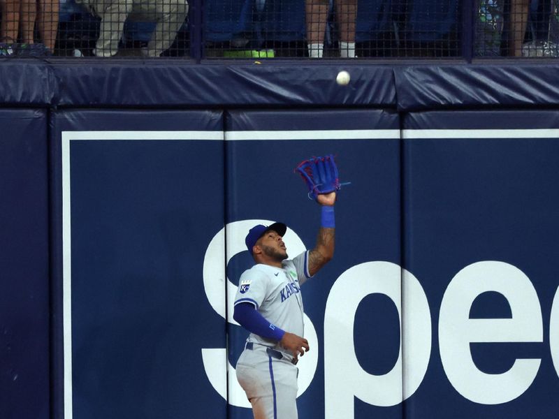 May 24, 2024; St. Petersburg, Florida, USA;  Kansas City Royals outfielder Nelson Velazquez (17) catches a fly ball against the Tampa Bay Rays during the ninth inning at Tropicana Field. Mandatory Credit: Kim Klement Neitzel-USA TODAY Sports