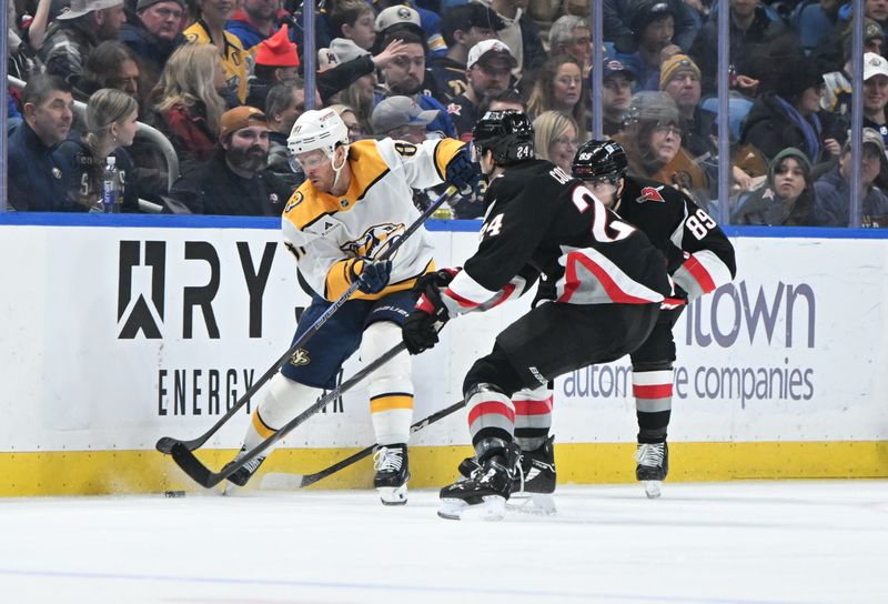 Jan 31, 2025; Buffalo, New York, USA; Nashville Predators center Jonathan Marchessault (81) and Buffalo Sabres center Dylan Cozens (24) vie for the puck in the second period at the KeyBank Center. Mandatory Credit: Mark Konezny-Imagn Images