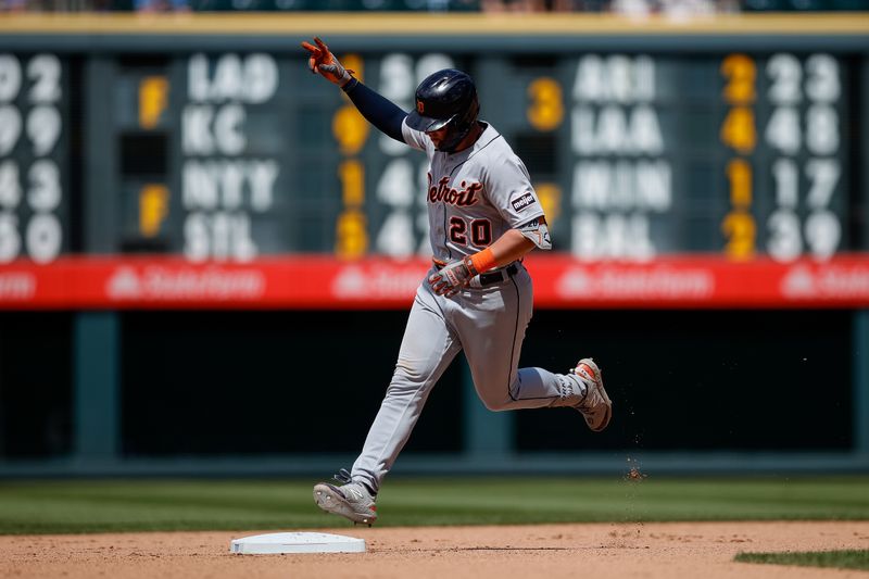 Jul 2, 2023; Denver, Colorado, USA; Detroit Tigers first baseman Spencer Torkelson (20) gestures as he rounds the bases on a two run home run in the seventh inning against the Colorado Rockies at Coors Field. Mandatory Credit: Isaiah J. Downing-USA TODAY Sports