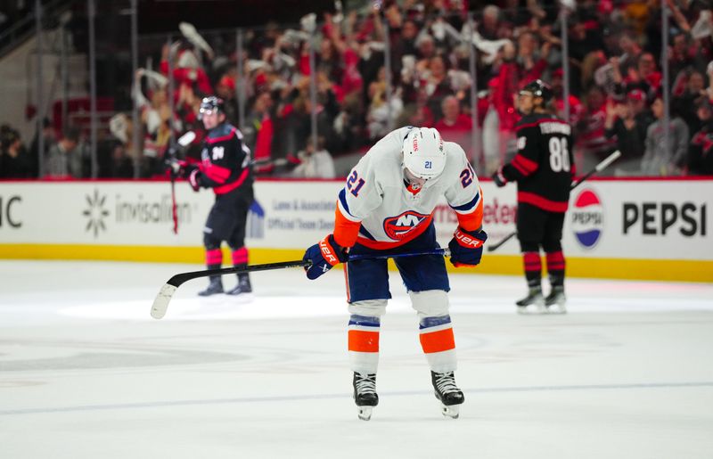 Apr 30, 2024; Raleigh, North Carolina, USA; New York Islanders center Kyle Palmieri (21) looks down after Carolina Hurricanes center Seth Jarvis (24) empty net goal during the third period in game five of the first round of the 2024 Stanley Cup Playoffs at PNC Arena. Mandatory Credit: James Guillory-USA TODAY Sports