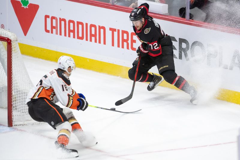 Feb 15, 2024; Ottawa, Ontario, CAN; Anaheim Ducks center Ryan Strome (16) battles for the puck with Ottawa Senators defenseman Thomas Chabot (72) in the third period at the Canadian Tire Centre. Mandatory Credit: Marc DesRosiers-USA TODAY Sports