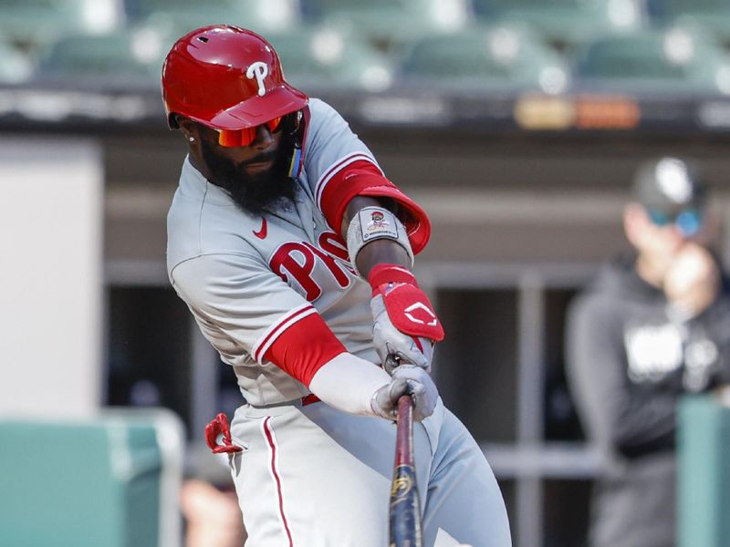 Apr 18, 2023; Chicago, Illinois, USA; Philadelphia Phillies second baseman Josh Harrison (2) hits a two-run single against the Chicago White Sox during the third inning of game one of the doubleheader at Guaranteed Rate Field. Mandatory Credit: Kamil Krzaczynski-USA TODAY Sports