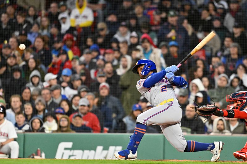 May 21, 2025; Boston, Massachusetts, USA; New York Mets second baseman Luisangel Acuna (2) hits a single  against against the Boston Red Sox during the fifth inning at Fenway Park. Mandatory Credit: Eric Canha-Imagn Images