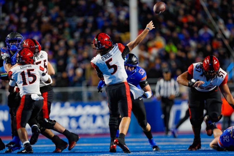 Nov 1, 2024; Boise, Idaho, USA; San Diego State Aztecs quarterback Danny O'Neil (5) throws a long pass during the second half against the Boise State Broncos  at Albertsons Stadium. Boise State defeats San Diego State  56-24.  Mandatory Credit: Brian Losness-Imagn Images
