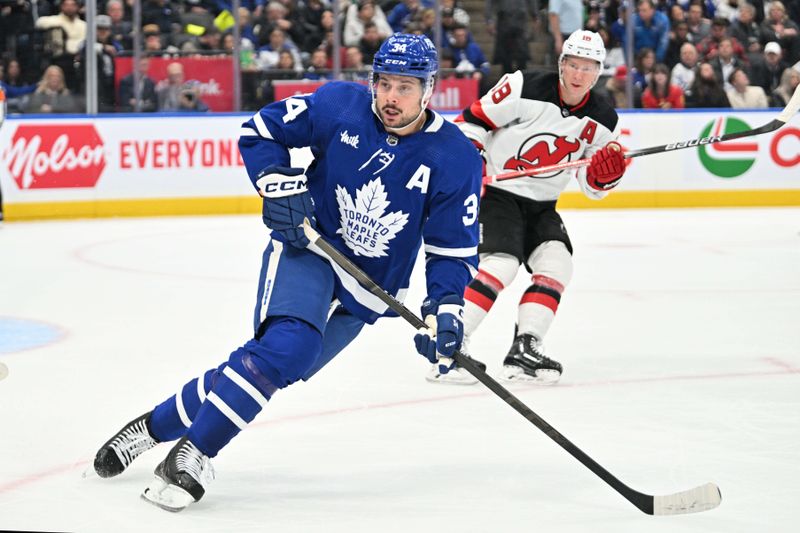 Apr 11, 2024; Toronto, Ontario, CAN; Toronto Maple Leafs forward Auston Matthews (34) pursues the play against the New Jersey Devils in the first period at Scotiabank Arena. Mandatory Credit: Dan Hamilton-USA TODAY Sports