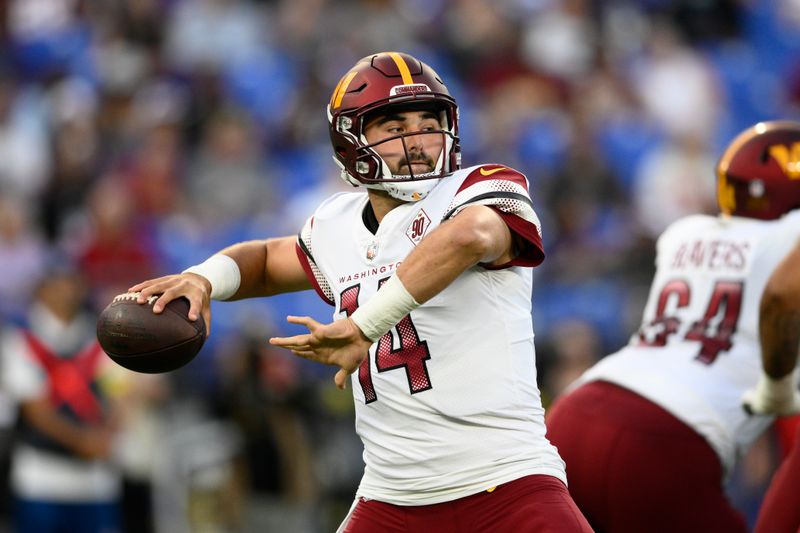 Washington Commanders quarterback Sam Howell throws to a receiver in the first half of a preseason NFL football game against the Baltimore Ravens, Saturday, Aug. 27, 2022, in Baltimore. (AP Photo/Nick Wass)