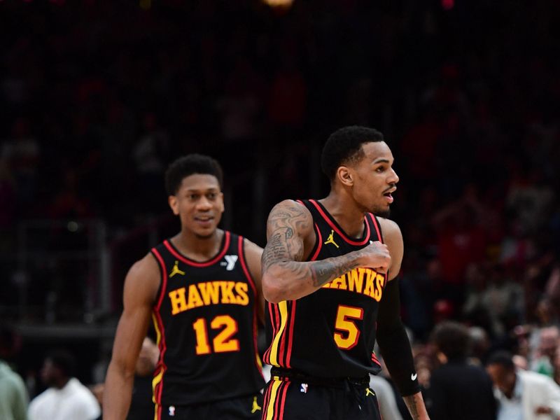 ATLANTA, GA - MARCH 28: Dejounte Murray #5 of the Atlanta Hawks celebrates after scoring the game winning shot during the game against the Boston Celtics on March 28, 2024 at State Farm Arena in Atlanta, Georgia.  NOTE TO USER: User expressly acknowledges and agrees that, by downloading and/or using this Photograph, user is consenting to the terms and conditions of the Getty Images License Agreement. Mandatory Copyright Notice: Copyright 2024 NBAE (Photo by Scott Cunningham/NBAE via Getty Images)