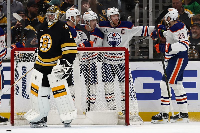 Dec 18, 2025; Boston, Massachusetts, USA; Edmonton Oilers center Ryan Nugent-Hopkins (93) celebrates with center Connor McDavid (97) and center Leon Draisaitl (29) after scoring on Boston Bruins goaltender Jeremy Swayman (1) during the first period at TD Garden. Mandatory Credit: Winslow Townson-Imagn Images