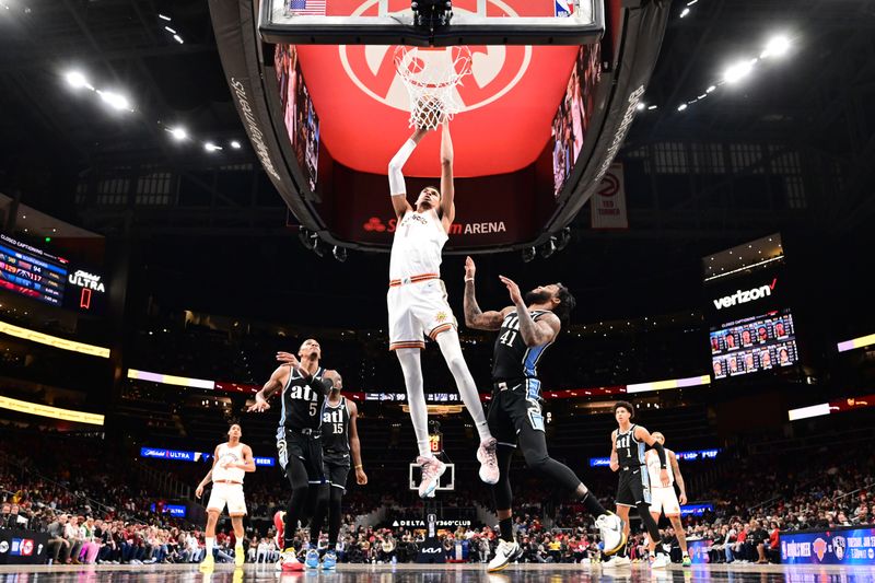 ATLANTA, GA - JANUARY 15: Victor Wembanyama #1 of the San Antonio Spurs drives to the basket during the game against the Atlanta Hawks on January 15, 2024 at State Farm Arena in Atlanta, Georgia.  NOTE TO USER: User expressly acknowledges and agrees that, by downloading and/or using this Photograph, user is consenting to the terms and conditions of the Getty Images License Agreement. Mandatory Copyright Notice: Copyright 2024 NBAE (Photo by Adam Hagy/NBAE via Getty Images)