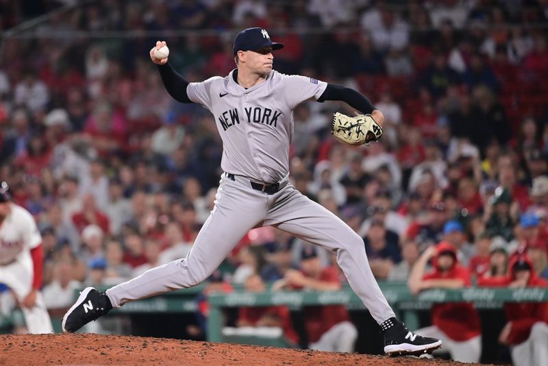 Jul 28, 2024; Boston, Massachusetts, USA; New York Yankees pitcher Jake Cousins (61) pitches against the Boston Red Sox during the seventh inning at Fenway Park. Mandatory Credit: Eric Canha-USA TODAY Sports