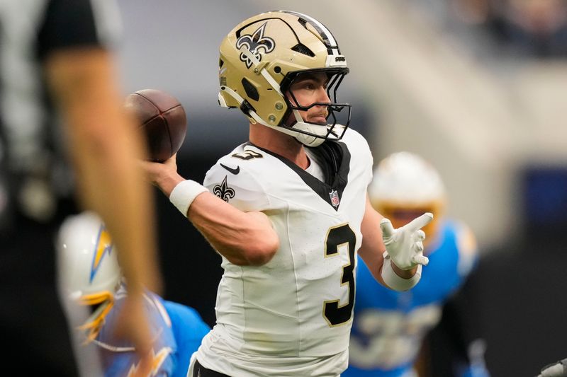 New Orleans Saints quarterback Jake Haener (3) passes in the second half of an NFL football game against the Los Angeles Chargers in Inglewood, Calif., Sunday, Oct. 27, 2024. (AP Photo/Mark J. Terrill)