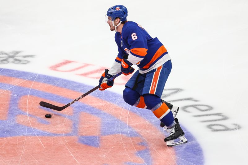 Apr 27, 2024; Elmont, New York, USA; New York Islanders defenseman Ryan Pulock (6) controls the puck against the Carolina Hurricanes in game four of the first round of the 2024 Stanley Cup Playoffs at UBS Arena. Mandatory Credit: Wendell Cruz-USA TODAY Sports