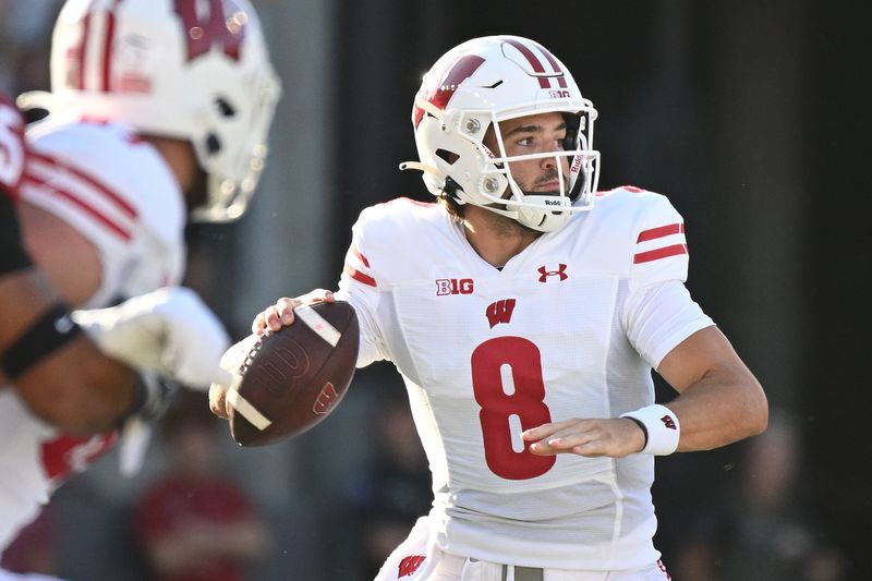 Sep 9, 2023; Pullman, Washington, USA; Wisconsin Badgers quarterback Tanner Mordecai (8) throws a pass against the Washington State Cougars in the first half at Gesa Field at Martin Stadium. Mandatory Credit: James Snook-USA TODAY Sports