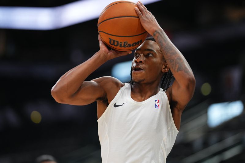 SAN ANTONIO, TX - NOVEMBER 2: Rob Dillingham #4 of the Minnesota Timberwolves warms up before the game against the San Antonio Spurs on November 2, 2024 at the Frost Bank Center in San Antonio, Texas. NOTE TO USER: User expressly acknowledges and agrees that, by downloading and or using this photograph, user is consenting to the terms and conditions of the Getty Images License Agreement. Mandatory Copyright Notice: Copyright 2024 NBAE (Photos by Cooper Neill/NBAE via Getty Images)