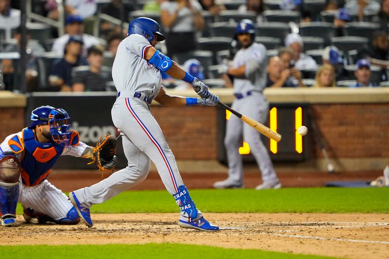 Aug 30, 2023; New York City, New York, USA; Texas Rangers center fielder Leody Taveras (3) hits a single against the New York Mets during the sixth inning at Citi Field. Mandatory Credit: Gregory Fisher-USA TODAY Sports