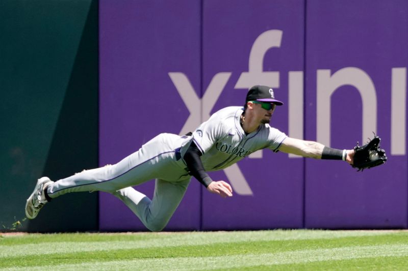 Jun 30, 2024; Chicago, Illinois, USA; Colorado Rockies outfielder Brenton Doyle (9) makes a catch against Chicago White Sox outfielder Luis Robert Jr. (not pictured) during the sixth inning at Guaranteed Rate Field. Mandatory Credit: David Banks-USA TODAY Sports