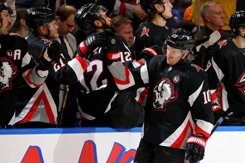 Nov 3, 2023; Buffalo, New York, USA;  Buffalo Sabres defenseman Henri Jokiharju (10) celebrates his goal with teammates during the third period against the Philadelphia Flyers at KeyBank Center. Mandatory Credit: Timothy T. Ludwig-USA TODAY Sports