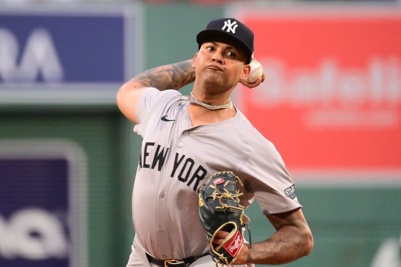 Jun 14, 2024; Boston, Massachusetts, USA; New York Yankees starting pitcher Luis Gil (81) pitches against the Boston Red Sox during the first inning at Fenway Park. Mandatory Credit: Eric Canha-USA TODAY Sports