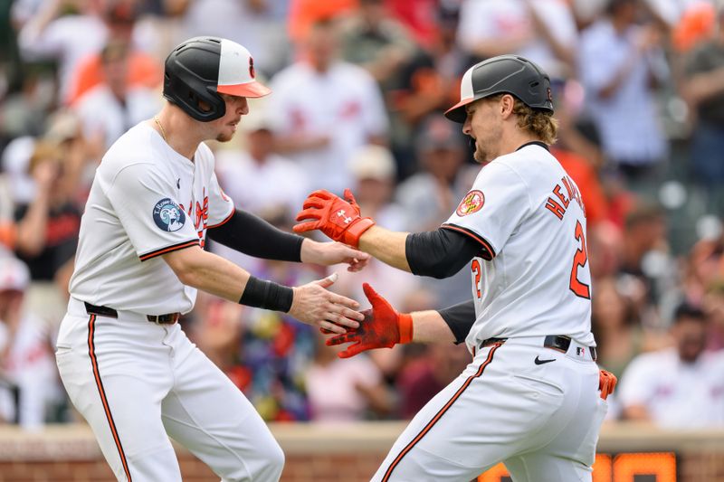 Aug 18, 2024; Baltimore, Maryland, USA; Baltimore Orioles shortstop Gunnar Henderson (2) celebrates with first baseman Ryan O'Hearn (32) after hitting a home run during the sixth inning against the Boston Red Sox at Oriole Park at Camden Yards. Mandatory Credit: Reggie Hildred-USA TODAY Sports