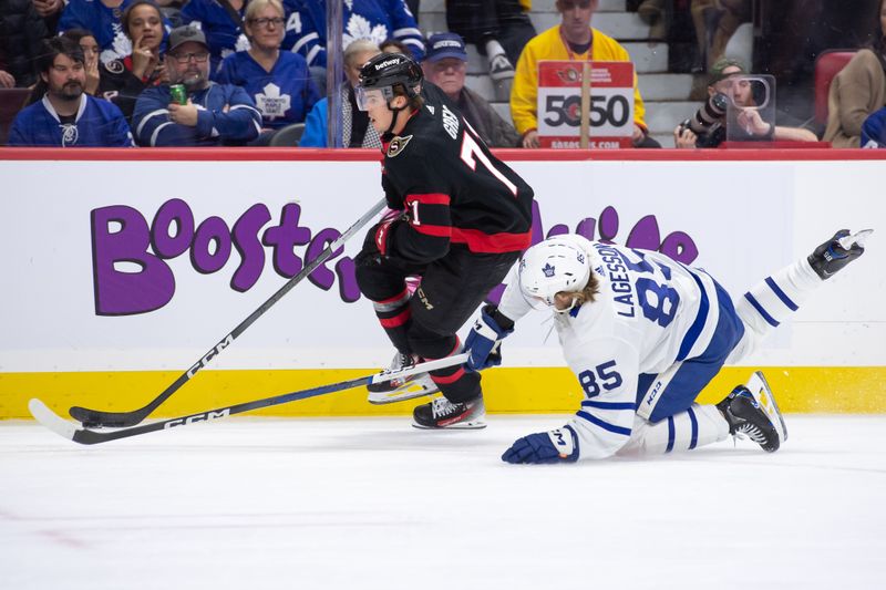 Feb 10, 2024; Ottawa, Ontario, CAN; Ottawa Senators center Ridly Greig (71) gets past Toronto Maple Leafs defenseman William Lagesson (85) in the first period at the Canadian Tire Centre. Mandatory Credit: Marc DesRosiers-USA TODAY Sports