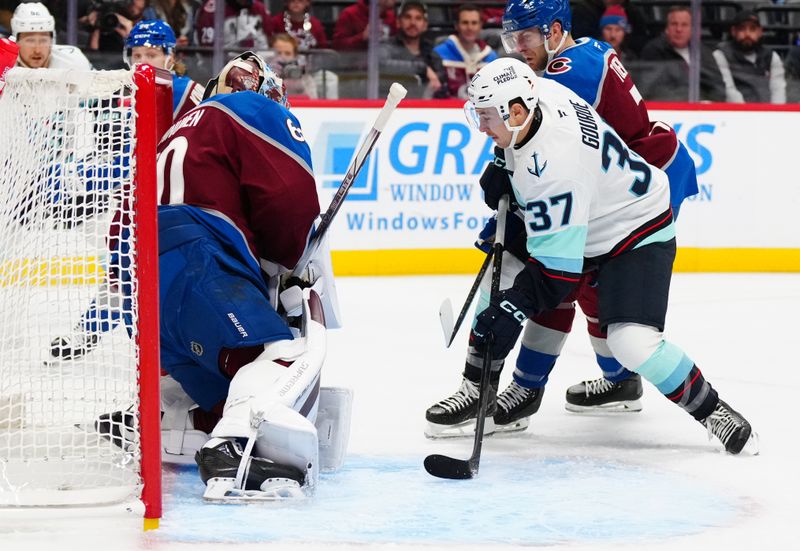 Nov 5, 2024; Denver, Colorado, USA; Seattle Kraken center Yanni Gourde (37) attempts to score on Colorado Avalanche goaltender Justus Annunen (60) in the first period at Ball Arena. Mandatory Credit: Ron Chenoy-Imagn Images