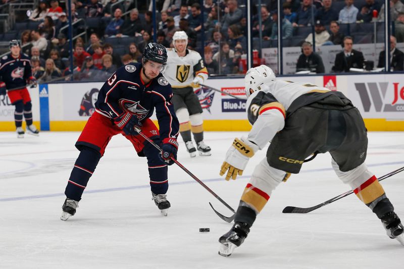 Mar 4, 2024; Columbus, Ohio, USA; Columbus Blue Jackets left wing Johnny Gaudreau (13) passes the puck as Vegas Golden Knights defenseman Brayden McNabb (3) defends during the second period at Nationwide Arena. Mandatory Credit: Russell LaBounty-USA TODAY Sports