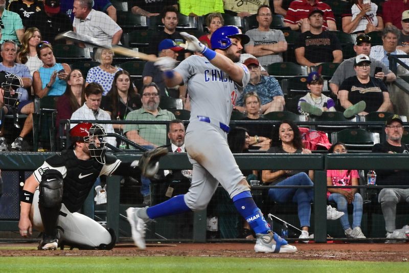 Apr 17, 2024; Phoenix, Arizona, USA;  Chicago Cubs outfielder Mike Tauchman (40) singles in the seventh inning against the Arizona Diamondbacks at Chase Field. Mandatory Credit: Matt Kartozian-USA TODAY Sports