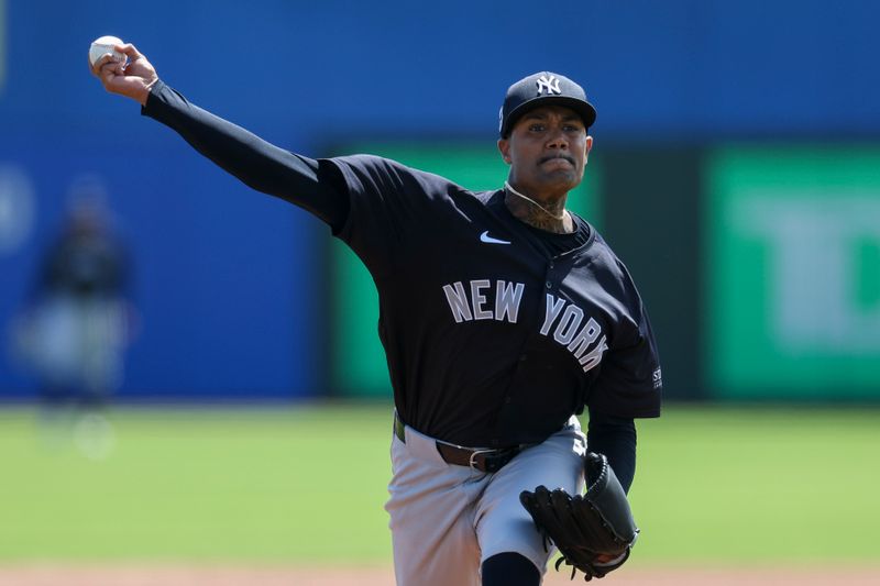 Mar 12, 2024; Dunedin, Florida, USA;  New York Yankees pitcher Dennis Santan (53) throws a pitch against the Toronto Blue Jays in the first inning at TD Ballpark. Mandatory Credit: Nathan Ray Seebeck-USA TODAY Sports