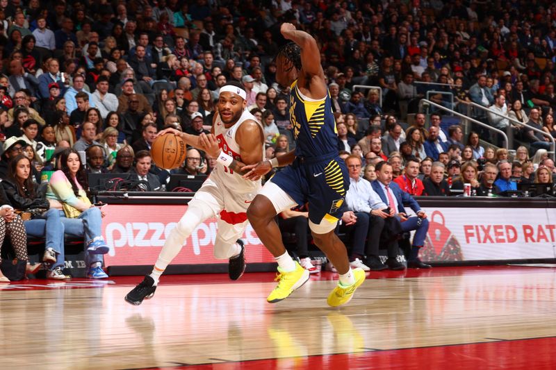 TORONTO, CANADA - APRIL 9:  Bruce Brown #11 of the Toronto Raptors goes to the basket during the game on April 9, 2024 at the Scotiabank Arena in Toronto, Ontario, Canada.  NOTE TO USER: User expressly acknowledges and agrees that, by downloading and or using this Photograph, user is consenting to the terms and conditions of the Getty Images License Agreement.  Mandatory Copyright Notice: Copyright 2024 NBAE (Photo by Vaughn Ridley/NBAE via Getty Images)