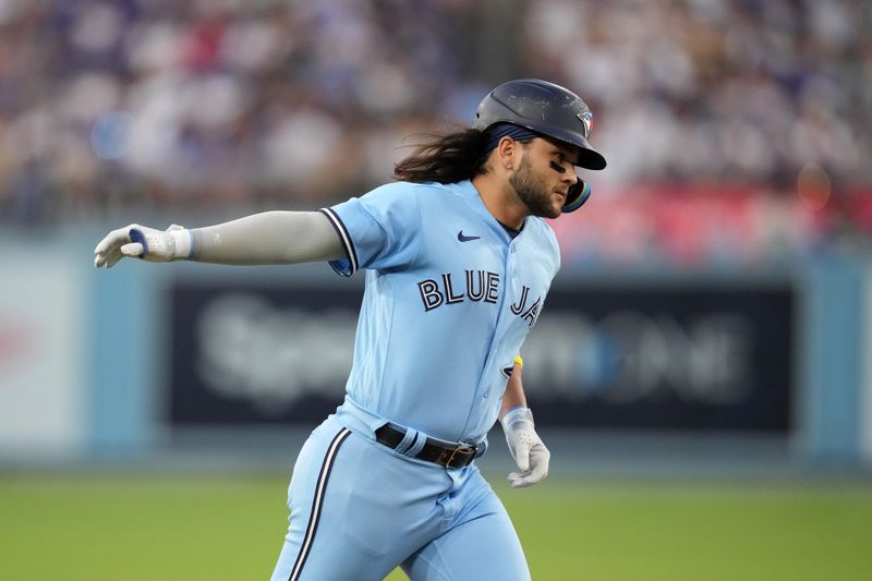 Jul 25, 2023; Los Angeles, California, USA; Toronto Blue Jays shortstop Bo Bichette (11) rounds the bases after hitting a two-run home run in the third inning against the Los Angeles Dodgers at Dodger Stadium. Mandatory Credit: Kirby Lee-USA TODAY Sports