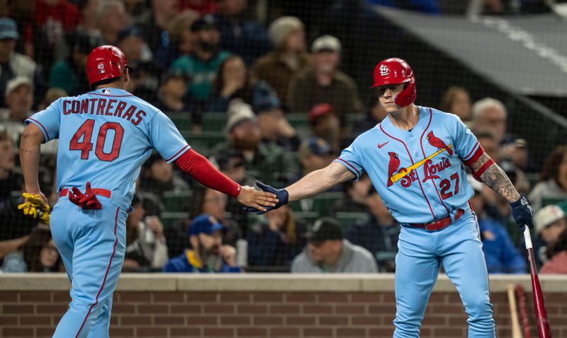 Apr 22, 2023; Seattle, Washington, USA; St. Louis Cardinals catcher Willson Contreras (40) is congratulated by left fielder Tyler O'Neill (27) after scoring a run during the third inning against the Seattle Mariners at T-Mobile Park. Mandatory Credit: Stephen Brashear-USA TODAY Sports