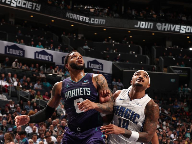 CHARLOTTE, NC - MARCH 5: Miles Bridges #0 of the Charlotte Hornets and Gary Harris #14 of the Orlando Magic box out during the game on March 5, 2024 at Spectrum Center in Charlotte, North Carolina. NOTE TO USER: User expressly acknowledges and agrees that, by downloading and or using this photograph, User is consenting to the terms and conditions of the Getty Images License Agreement. Mandatory Copyright Notice: Copyright 2024 NBAE (Photo by Kent Smith/NBAE via Getty Images)