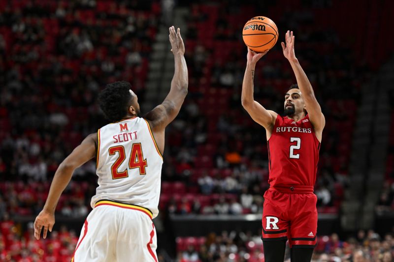 Feb 6, 2024; College Park, Maryland, USA; Rutgers Scarlet Knights guard Noah Fernandes (2) shoots over Maryland Terrapins forward Donta Scott (24) during the first half  at Xfinity Center. Mandatory Credit: Tommy Gilligan-USA TODAY Sports