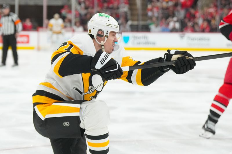 Mar 18, 2026; Raleigh, North Carolina, USA;  Pittsburgh Penguins center Evgeni Malkin (71) takes a shot against the Carolina Hurricanes during the second period at Lenovo Center. Mandatory Credit: James Guillory-Imagn Images