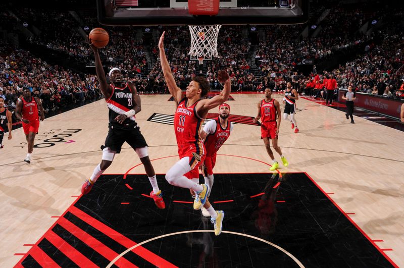 PORTLAND, OR - APRIL 9: Duop Reath #26 of the Portland Trail Blazers drives to the basket during the game against the New Orleans Pelicans on April 9, 2024 at the Moda Center Arena in Portland, Oregon. NOTE TO USER: User expressly acknowledges and agrees that, by downloading and or using this photograph, user is consenting to the terms and conditions of the Getty Images License Agreement. Mandatory Copyright Notice: Copyright 2024 NBAE (Photo by Cameron Browne/NBAE via Getty Images)