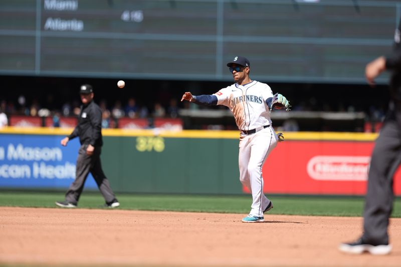 Aug 7, 2025; Seattle, Washington, USA; Seattle Mariners third baseman Jorge Polanco (7) throws the ball to first during the fifth inning against the Chicago White Sox at T-Mobile Park. Mandatory Credit: Kevin Ng-Imagn Images