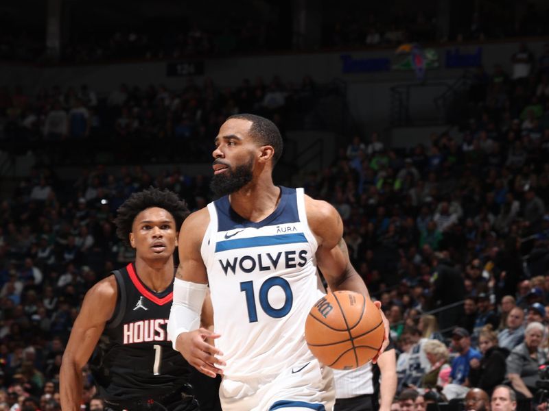 MINNEAPOLIS, MN -  FEBRUARY 4: Mike Conley #10 of the Minnesota Timberwolves dribbles the ball during the game against the Houston Rockets on February 4, 2024 at Target Center in Minneapolis, Minnesota. NOTE TO USER: User expressly acknowledges and agrees that, by downloading and or using this Photograph, user is consenting to the terms and conditions of the Getty Images License Agreement. Mandatory Copyright Notice: Copyright 2024 NBAE (Photo by David Sherman/NBAE via Getty Images)